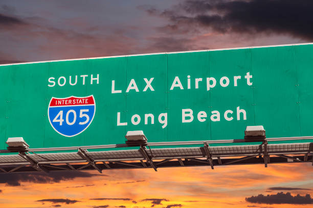 LAX Airport Freeway Sign with Sunset Sky