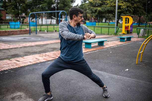 istock Mature man stretching outdoors 1473065247