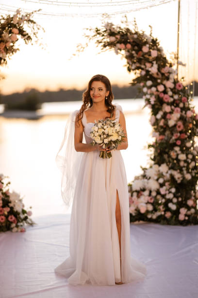istock bride against the background of a yellow sunset 1473069877