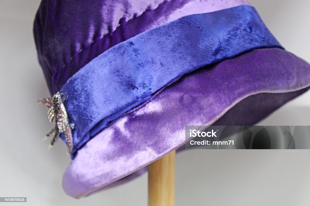 Antique purple/blue hat on hatstand at the antique stores 1920-1929 Stock Photo