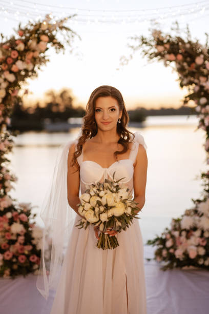 istock bride against the background of a yellow sunset 1473070536