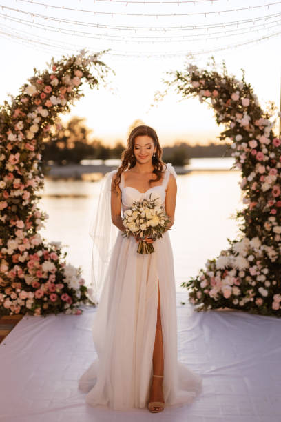 istock bride against the background of a yellow sunset 1473070545