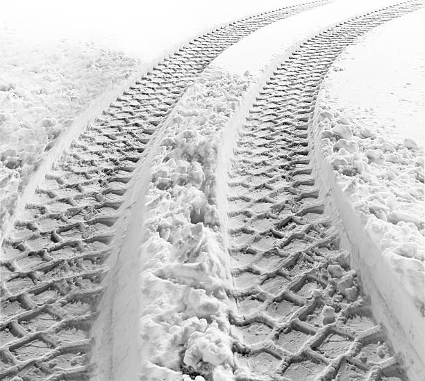 istock Huge deep tyre tracks that have been left in the snow 147307165