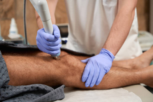 istock Progressive medic doing the radiofrequency therapy procedure at clinic 1473073057