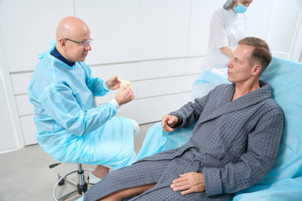 istock Calm patient and professional medic having talk before starting treatment 1473074259