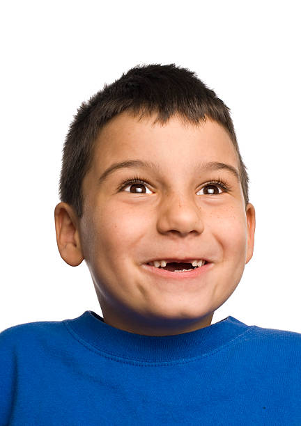 Boy loses teeth stock photo