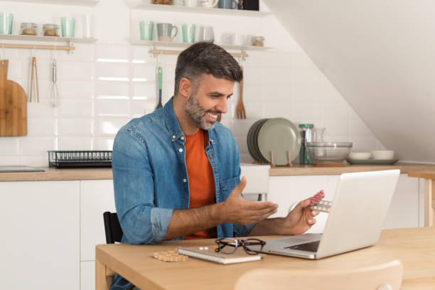 istock Man consulting online with his doctor about taking vitamins 1473075374