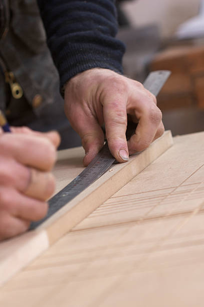 istock Carpenter Marking Out Wood 147307540