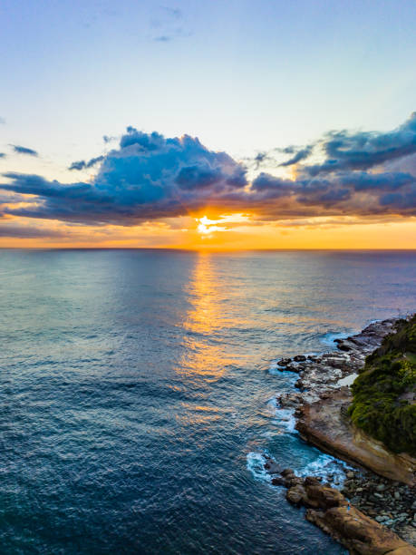 istock Ocean sunrise with clouds  and golden path 1473076333