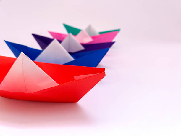 istock paper boats on a white background 1473077276