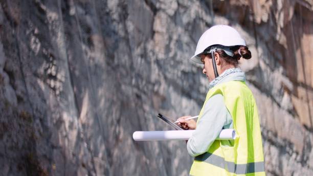 istock Female road engineer works on new highway. 1473078188