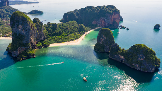 ao nang and rai lay with pranang beach and long tail speedboat passengers tourist in high season at kra bi Thailand aerial landscape view