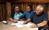 istock Early voting - family around a table in their hogan 1473082664