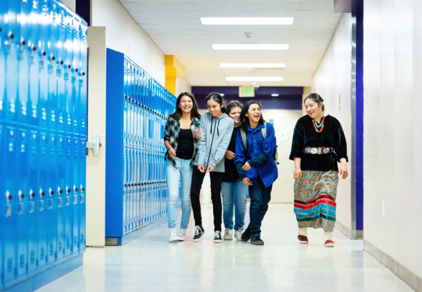 istock Five navajo friends walking on the corridor 1473083938