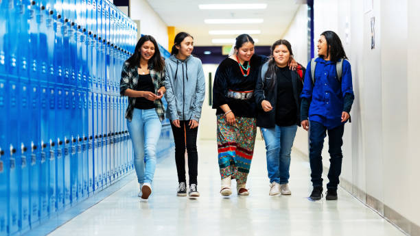 istock A group of happy students walking on the corridor 1473083990