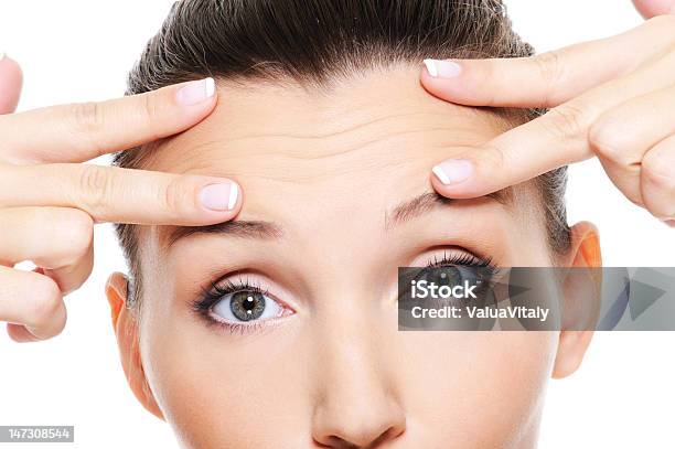 Young Womans Face Showing Wrinkles On Forehead Stock Photo - Download Image Now - Wrinkled, Forehead, Women