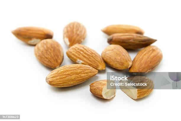 Almonds On White Stock Photo - Download Image Now - Almond, Broken, Brown