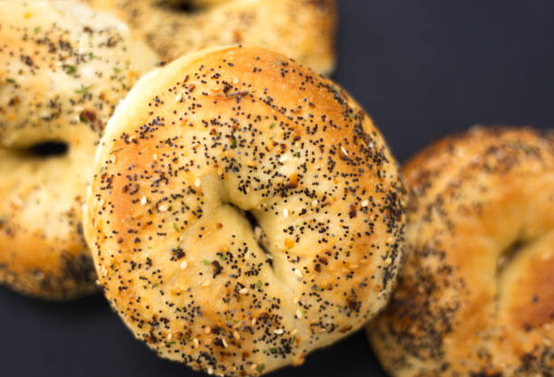 istock Pile of Fresh Bagels, Black Background 1473088376