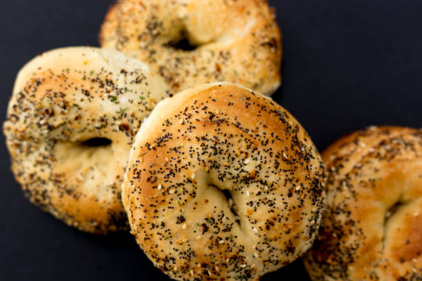 istock Pile of Fresh Bagels, Black Background 1473088427