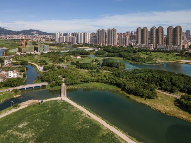 istock Modern urban architecture and wetland park 1473094377