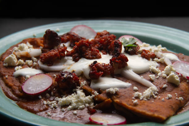 istock Mexican enfrijoladas with chorizo and fresh cheese 1473094618
