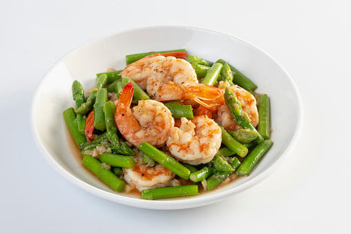 Asparagus stir fried with shrimp isolated white background