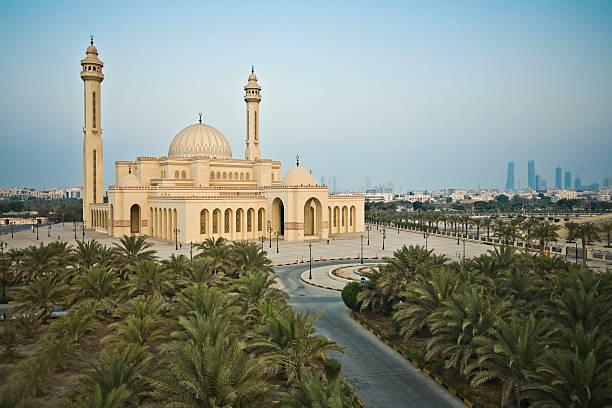AlFateh Mosque Bahrain with blue sky Ahmed Al-Fateh Mosque is located in Manama, Bahrain's capital, and is part of an Islamic center. The center includes the mosque, a department for Qur'anic studies and an Islamic library. Construction work of Ahmed Al-Fateh Center began in 1984. It was opened in 1988 by the late Amir of Bahrain, Sheikh Issa bin Salman Al-Khalifa. The mosque occupies an area of 6,500 square meters and it can accommodate up to 7000 worshippers. Daily congregational prayers as well as Friday prayers are held at the mosque. bahrain stock pictures, royalty-free photos & images