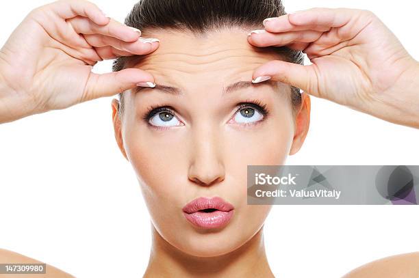 Female Face With Wrinkles On Her Forehead Stock Photo - Download Image Now - Wrinkled, Forehead, Human Face