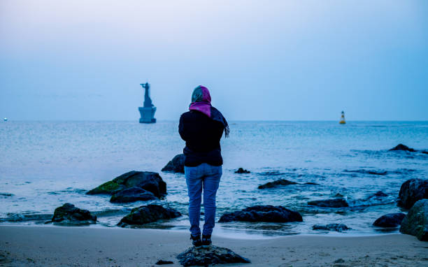 female tourist enjoy to watching scenery of Haeundae beach during summer tour at Busan, South Korea, on  Saturday March 02, 2019
