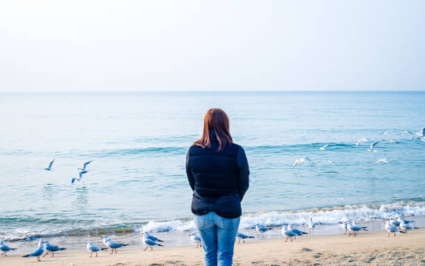 female tourist enjoy to watching scenery of Haeundae beach during summer tour at Busan, South Korea, on  Saturday March 02, 2019