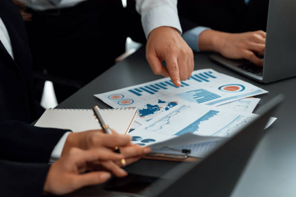 istock Closeup focus on BI dashboard with office worker in harmony office. 1473101990