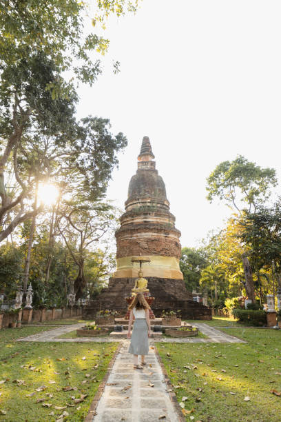 istock A woman visiting a Buddhist temple 1473104274