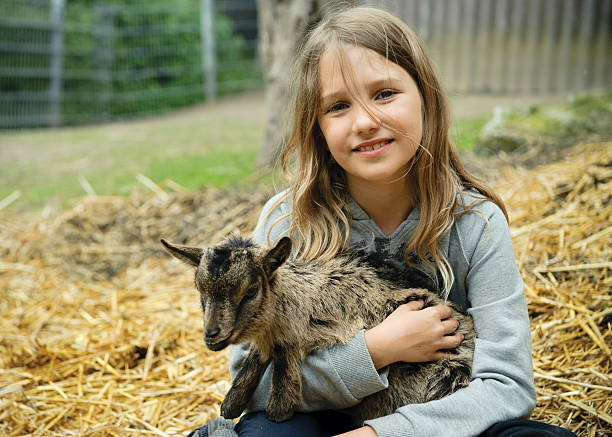Girl with goatling