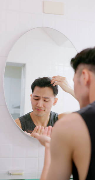istock man worry about hair loss 1473106477