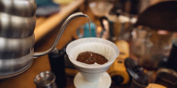 istock Closeup of hand make drip coffee in home 1473111566