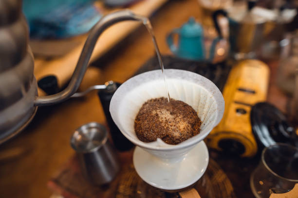istock Closeup of hand make drip coffee in home 1473111580
