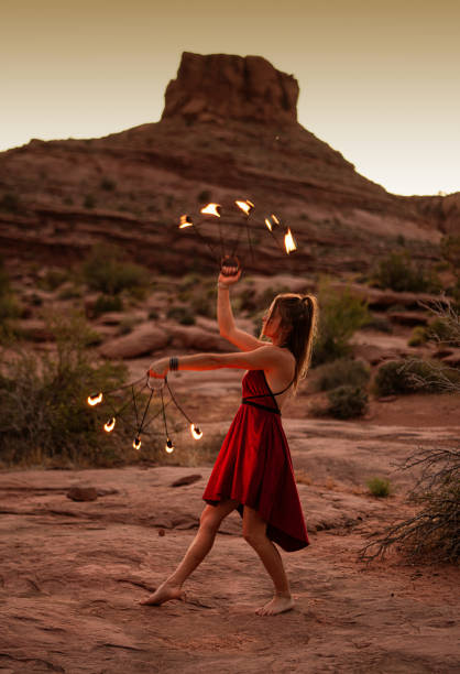 istock Fire dancer performing at dusk in Moab Park, USA 1473112629