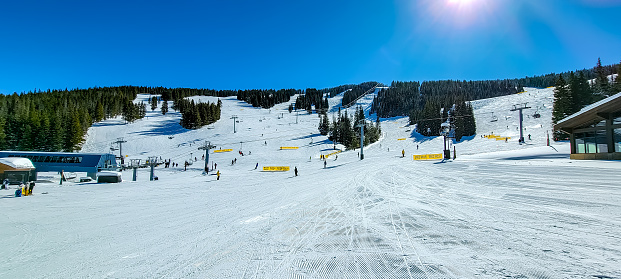 Views of Vail Mountain, Skiers enjoying a beautiful day, Vail, Colorado, looking up the slopes from Mid Vail