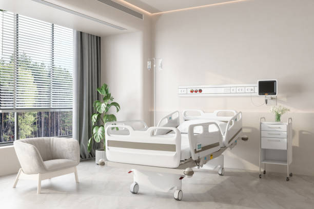 interno moderno della camera d'ospedale di lusso con letto vuoto, poltrona e pianta in vaso - contemporary bed luxury hotel room foto e immagini stock