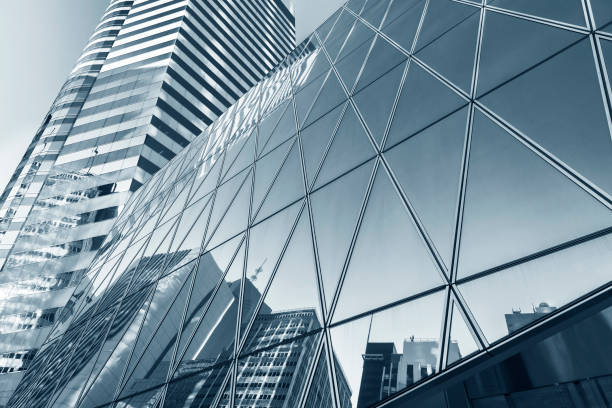 Reflection of urban skyline on modern office building