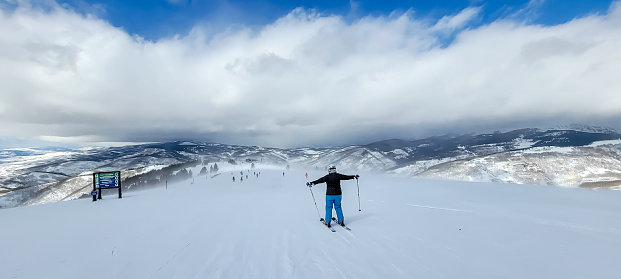 Skiers enjoying a beautiful day at Vail Mountain, Vail, Colorado