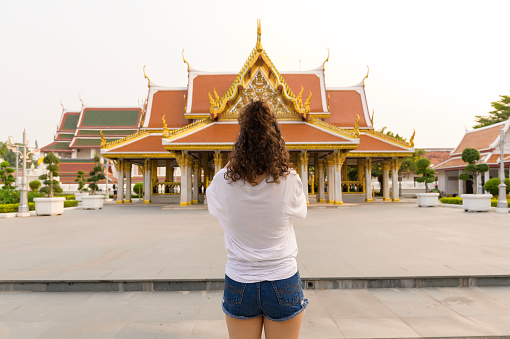 Beautiful young Asian tourist woman on vacation sightseeing and exploring Bangkok city, Thailand, Holidays and traveling concept