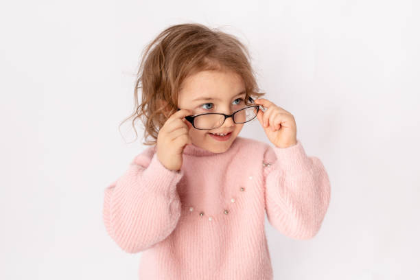 istock small child girl with glasses on white background, space for text 1473123818