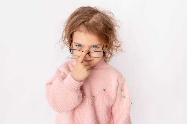 istock small child girl with glasses on white background, space for text 1473123821