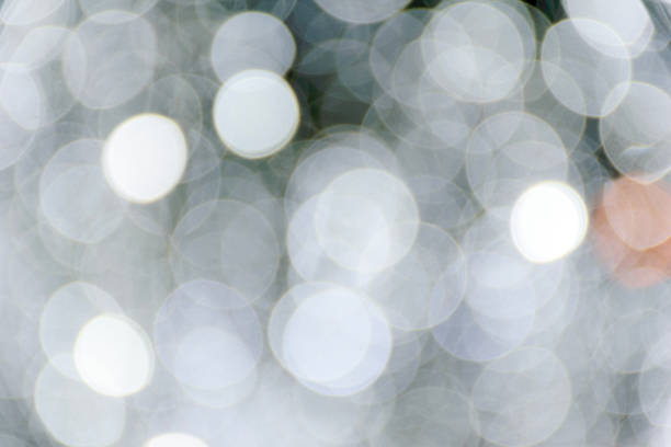 Glitter vintage lights background. silver, gold and white. de-focused. White, silver glitter vintage lights background defocused for festivals and celebrations