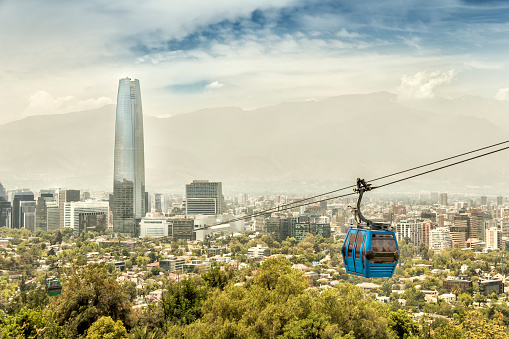 Rio de Janeiro, Brazil - July 4th, 2016: Sugarloaf mountain at sunset in Rio de Janeiro with a cable car full of tourists being transported to the peak in Brazil, South America