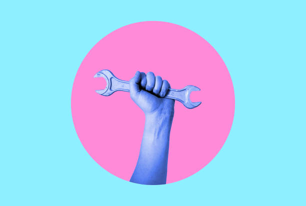 istock Art collage. Hand with a wrench in neon. 1473130348