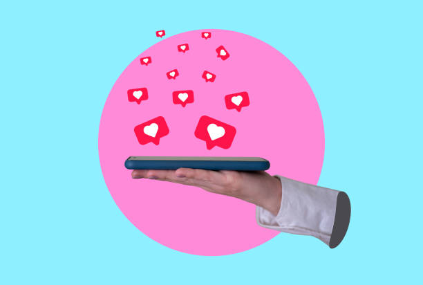 istock Art collage, a woman's hand holding a cell phone with hearts flying around it, Modern Art. 1473130355