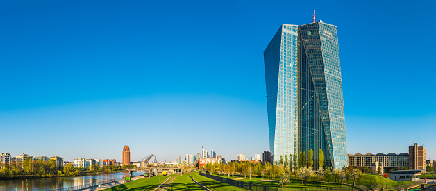 Panoramic view over the Ostend district of Frankfurt down the River Main to the financial district skyscrapers glinting in the early morning sun, Germany.