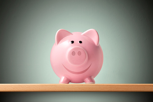 Yellow piggy bank, isolated on white background